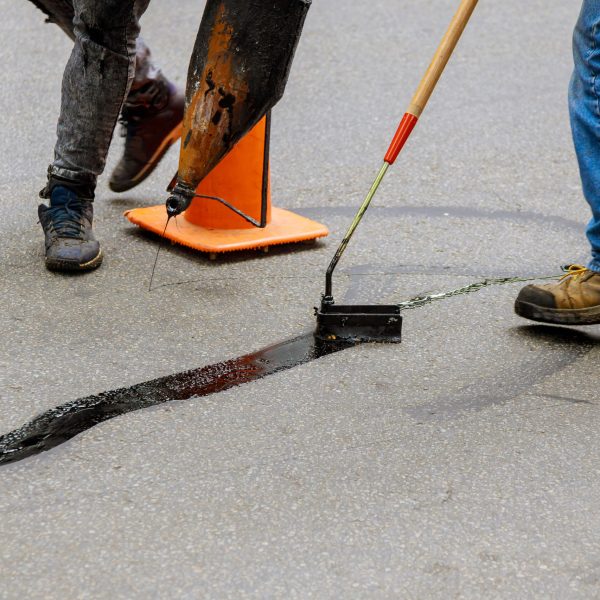 Road,Surface,Restoration,Work,In,The,Worker,Performs,On,Road